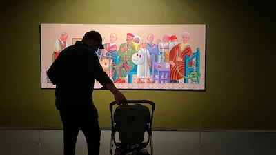 The writer and his son take in some art in Sharjah. Nasri Atallah / The National