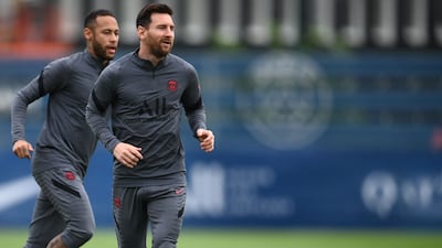 Paris Saint-Germain's Argentinian forward Lionel Messi (R), Brazilian forward Neymar take part during a training session at the club's Camp des Loges training ground in Saint-Germain-en-Laye on September 27, 2021. (Photo by FRANCK FIFE / AFP)