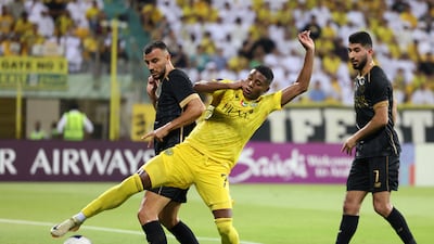 Al Wasl's Jonatas Santos battles with Al Sadd's Romain Saiss, who would later equalise for the Qataris as the game ended 1-1.