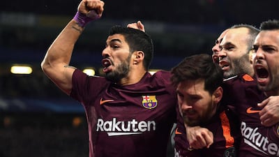 Lionel Messi, centre, celebrates with teammates after scoring Barcelona's equaliser in their 1-1 draw against Chelsea in the Champions League. Ben Stansall / AFP Photo