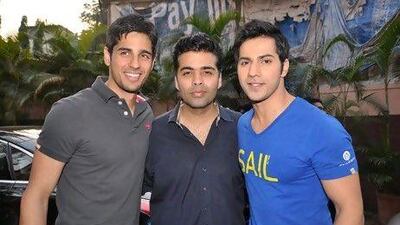 The Student of the Year director Karan Johar, centre, with the actors Sidharth Malhotra and Varun Dhawan, says he is not ready to announce his next project. IANS