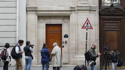 Members of the media stand outside the Paris offices of Google as French police carry out a search as part of a tax fraud investigation. Matthieu Alexandre / AFP