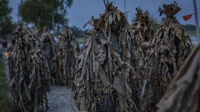 Devotees covered in mud and dried banana leaves take part in the Taong Putik ("mud people") Festival in the village of Bibiclat in Aliaga town, Nueva Ecija province, Philippines. Each year, the residents of Bibiclat village in Aliaga town celebrate the Feast of Saint John by covering themselves in mud, dried banana leaves, vines, and twigs as part of a little-known Catholic festival. Getty Images