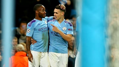 Phil Foden celebrates with Raheem Sterling after scoring Manchester City's second goal. AP Photo