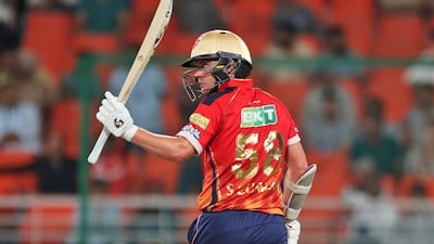 Punjab Kings' Sam Curran acknowledges his fifty. AP