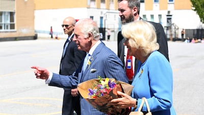 Britain's Prince Charles and Camilla, Duchess of Cornwall greets students during a visit at Assumption Catholic school May 18, 2022 in Ottawa. AFP