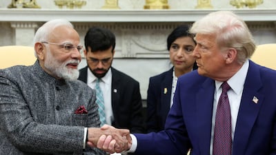 US President Donald Trump and Indian Prime Minister Narendra Modi shake hands at the White House on February 13, 2025. Reuters