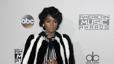Janelle Monae, wearing a Marc Jacobs dress and mink jacket, arrives at the 2016 American Music Awards on November 2, 2016. EPA