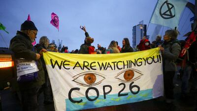 Extinction Rebellion environmental activists hold a protest outside the venue hosting Cop26 in Glasgow, Scotland. Reuters