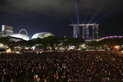 Fans arrive at The Padang to see pop-star Ariana Grande perform as part of the 2017 Formula 1 Singapore Grand Prix. Brendon Thorne / Singapore GP via Getty Images