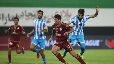 Sebastian Tagliabue of Al Wahda with Mohamed Ali of Dibba. Wahda's Argentine striker scored twice in a 3-1 win on January 7, 2016 at Al Nahyan Stadium in Abu Dhabi. Mona Al Marzooqi/ The National