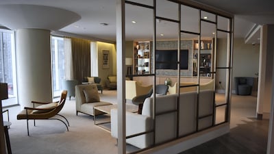 The living room of a penthouse in Circus West Village, which is already open and overlooking the Battersea Power Station with balcony views over the River Thames. Shafi Musaddique / The National