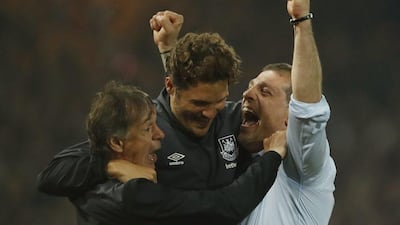 West Ham manager Slaven Bilic celebrates after the match with his coaching staff after beating Manchester United in the Premier League on Tuesday night. John Sibley / Action Images / Reuters / May 10, 2016
