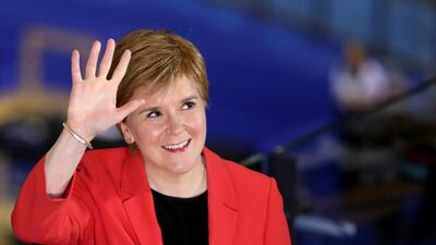 Scottish First Minister Nicola Sturgeon waves after her win. Reuters