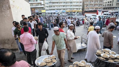 Iftar meals distributed at the New Fatima Mosque adjacent to the Al Ghubaiba Bus Station in Bur Dubai. Antonie Robertson / The National