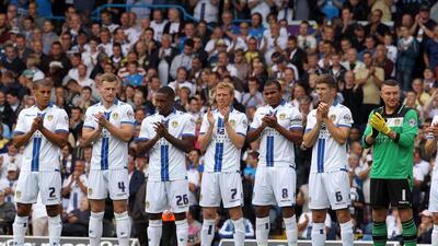 Players applaud fans who have passed away in the last 12 months during the Sky Bet Championship match between Leeds United and Sheffield at Elland Road on August 17, 2013 in Leeds, England. Tim Keeton/Getty Images