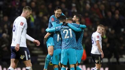 Son Heung-min celebrates with teammates. PA