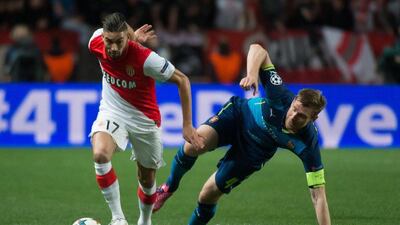 AS Monaco's Yannick Ferreira Carrasco vies for the ball with Arsenal's Per Mertesacker during their Champions League last 16 second leg match on Tuesday. Bertrand Langlois / AFP / March 17, 2015