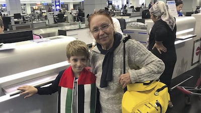 Grandmother Iodmela and grandson Ioe had racked up visa overstaying fines of Dh100,000 and were pleased to be able to return home to Uzbekistan. Zaina Abdul Al Kareem Ahmed