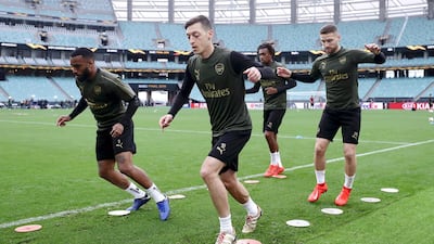 Mesut Ozil, front right, has made only one Premier League appearance for Arsenal this season and has been left out of the squad completely for the last three matches. Getty