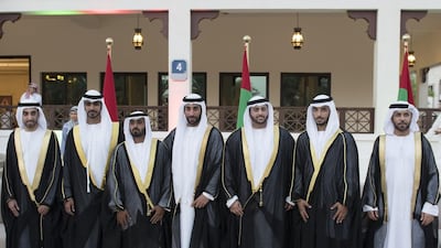 Grooms stand for a photograph during the group wedding. Abdulla Al Suwaidi for Crown Prince Court - Abu Dhabi