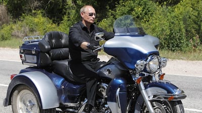 Putin rides Harley Davidson Lehman Trike as he leaves the meeting with motorbikers in Ukraine's Crimea Peninsula on July 24, 2010. AFP