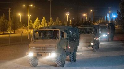 Turkish army soldiers drive towards the border with Syria near Akcakale in Sanliurfa province. AFP