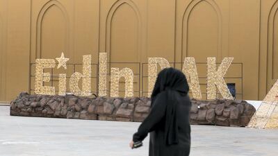 A woman arrives at the Eid fair in RAK's Exhibition centre. Reem Mohammed / The National