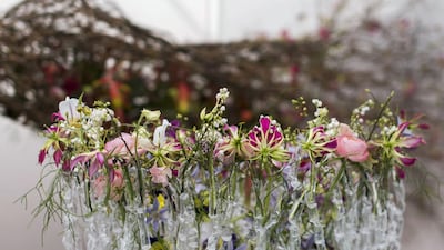Winning florist Van Laer's smaller work centred around recycling materials and sustainability, incorporated plastic tubes that Van Laer melted himself. “Nature is so strong that it can grow even when its ‘soil’ is plastic,” he says, in a reference to the growing trend towards hydroponics, an essential part of food sustainability in this part of the world. Reem Mohammed / The National