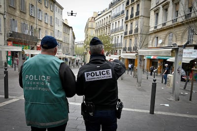 Police officers fly a drone as they patrol Marseille's Capucins during a nationwide lockdown. AFP