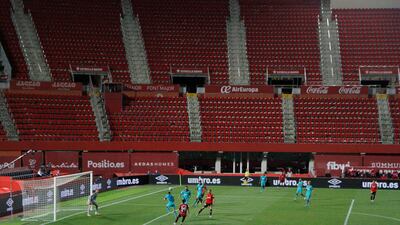 Mallorca and Barcelona players play inside an empty Son Moix Stadium. AP Photo