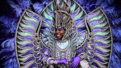 A man representing Brazil performs during the annual Carnival of Cultures parade in Berlin, Sunday, June 8, 2014. Thousands of people attend the festival with costumes from all over the world. AP