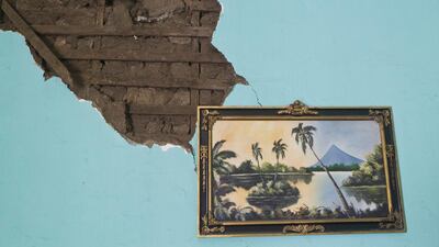 A painting of a Nicaragua lake is seen hanging from a wall inside a home damaged by an earthquake in Nagarote, Nicaragua. Nicaragua’s President Daniel Ortega declared red alert Friday after an earthquake of 6.2 magnitude on the Richter scale that shook the country on Thursday and left one dead, hundreds of houses damaged and thousands of people affected. Esteban Felix / AP