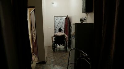 In this file photo, Anas al-Sarrari pushes his wheelchair in his home in Marib, Yemen in this July 29, 2018 photo. The activist was paralysed after being tortured in detention by Houthi rebels. AP