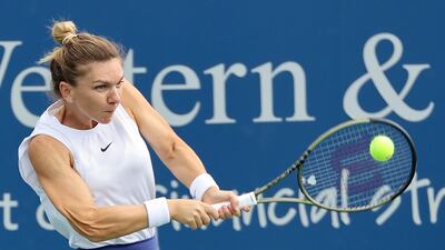 Simona Halep of Romania plays a backhand during her match against Magda Linette of Poland during Western & Southern Open.