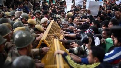 Protesters try to break through a police cordon during a demonstration over the death of a young woman who was recently gang-raped on a moving bus in New Delhi.