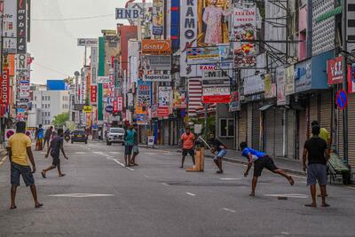 Young people play cricket during a curfew in Colombo, Sri Lanka on Wednesday, which was imposed on Monday evening. AFP