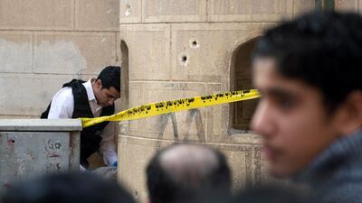 The two attackers opened fire at the entrance to the church of Mar Mina in Helwan district, which was being guarded by police in the run-up to Orthodox Christmas celebrations next week, security sources said. Mohamed Hossam / EPA