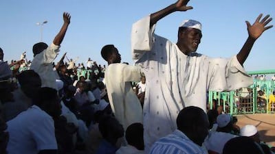 Spectators cheer at a weekly Nubian wrestling match on the outskirts of the Sudanese capital of Khartoum.