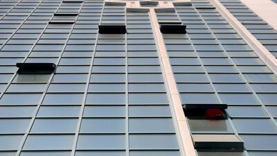 Windows in some high-rise buildings have no safety locks for kids who are left unattended. Ravindranath K / The National