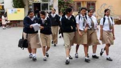 Students react after the Central Board Secondary Education exams, held at the Indian High School in Dubai.