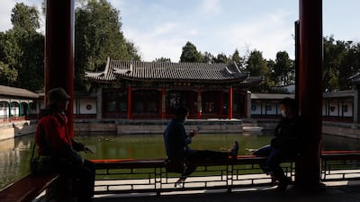 People rest at a temple at the Beihai Park in Beijing, China. EPA