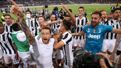 Marchisio and teammates celebrate after winning the league in Rome in May 2018. Reuters