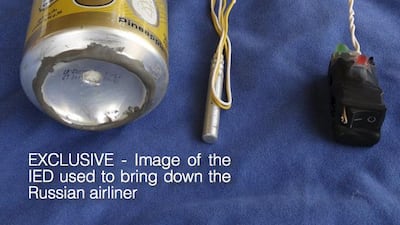 A photo published in ISIL magazine Dabiq shows a can of Schweppes Gold soft drink and what appeared to be a detonator and switch on a blue background. Social Media / Reuters