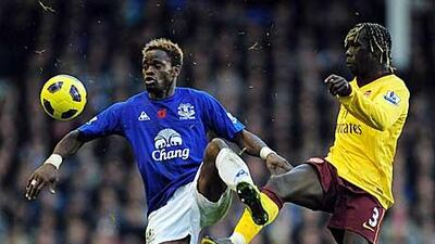 Louis Saha of Everton, left, is challenged by Bacary Sagna of Arsenal during their match at Goodison Park.