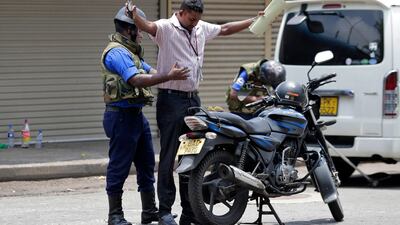 Sri Lankan navy soldiers perform security checks on motorists at a roadside in Colombo, Sri Lanka, Thursday, April 25, 2019. AP