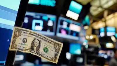 The dollar is making gains, expected to end the week on a yearly high. Mark Lennihan / AP