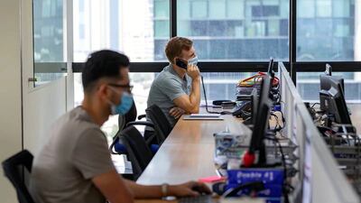 Under the UAE's labour law, employers must bear the cost of visas and residency renewals. Chris Whiteoak / The National