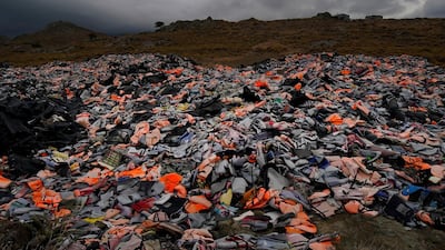 Thousands of Life jackets and rubber boats, abandoned by migrants who have made the crossing from Turkey to the Greek island of Lesbos, are dumped on open ground. Getty Images