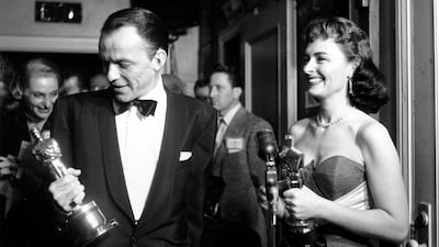 Frank Sinatra admires his Best Supporting Actor Oscar for From Here To Eternity at the 1954 Academy Awards